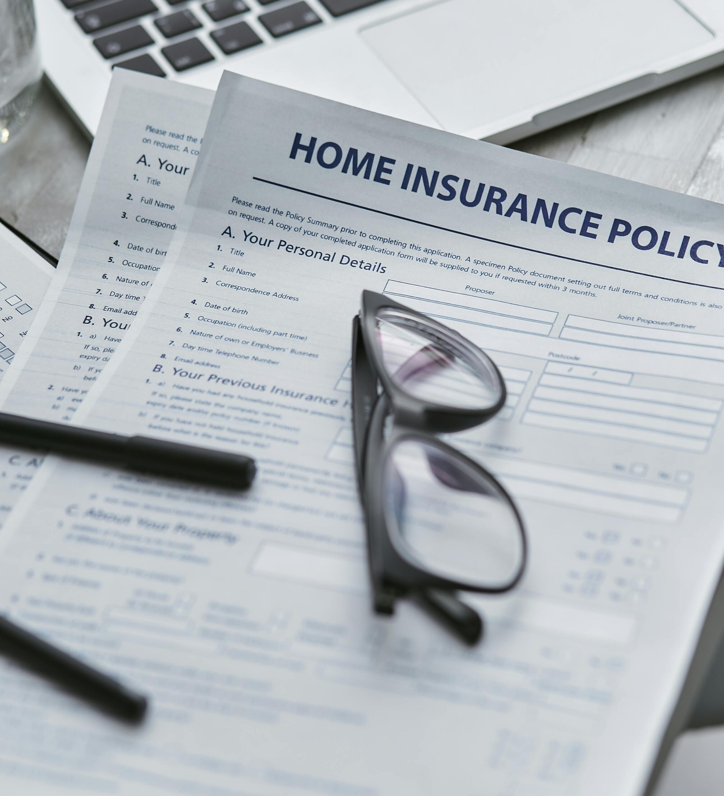 Insurance Policy and reading glasses