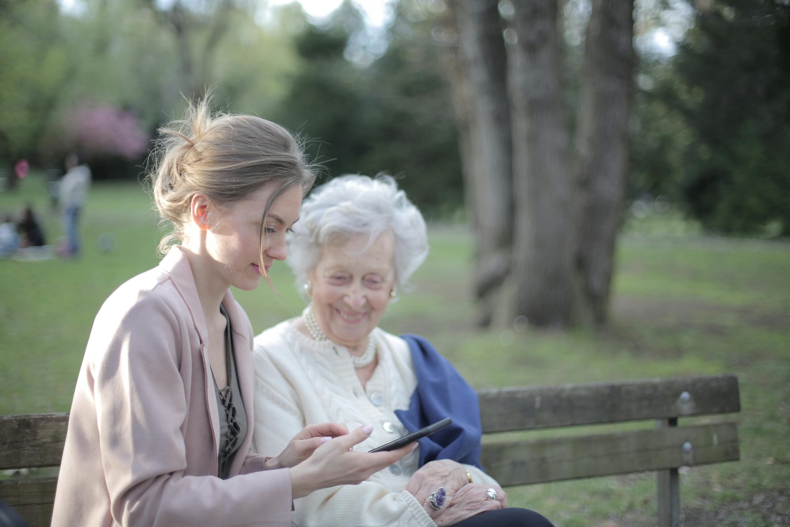 Mom and daughter on park bench